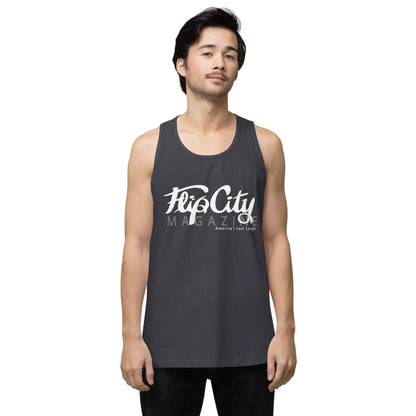 A man wearing a grey sleeveless tank top with white text 'Flip City Magazine' printed on the front.